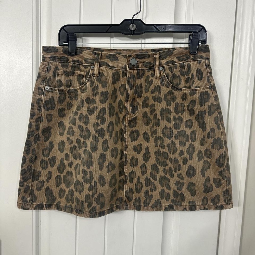 Blank NYC brown and black washed out leopard print denim mini skirt.